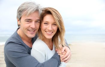 Cheerful mature couple with perfect smiles